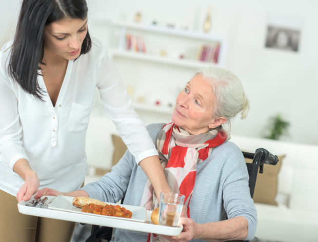 taking the tray from the elderly