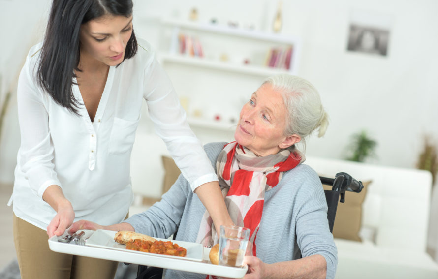 taking the tray from the elderly